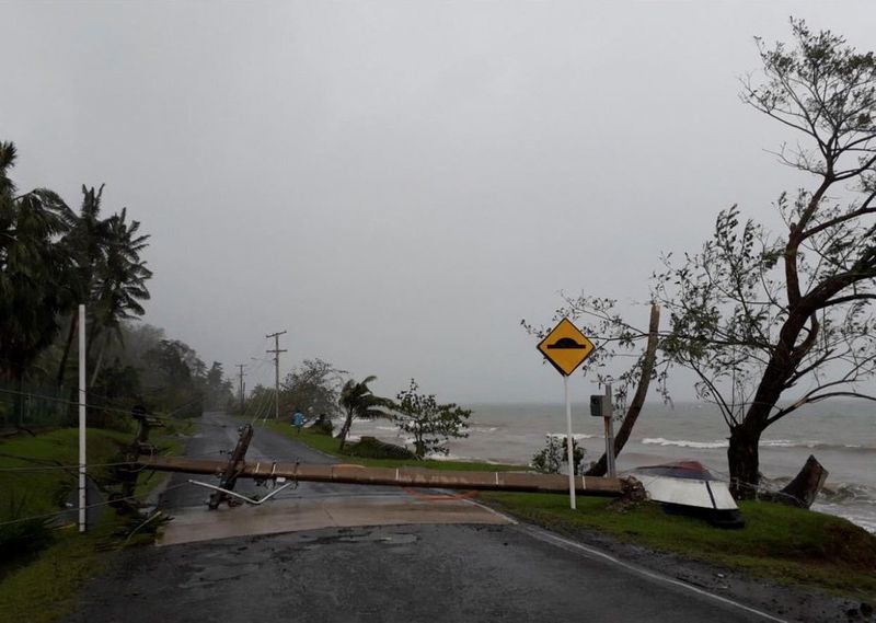 A fallen electric pole due to Cyclone Yasa lies on