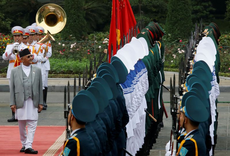 Nepal’s PM K. P. Oli reviews the guard of honour