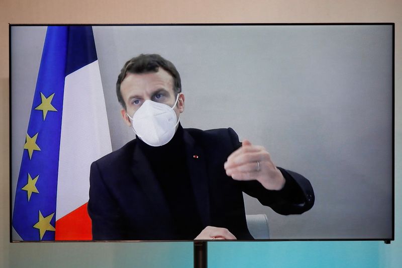 FILE PHOTO: French President Macron, tested positive for coronavirus, talks