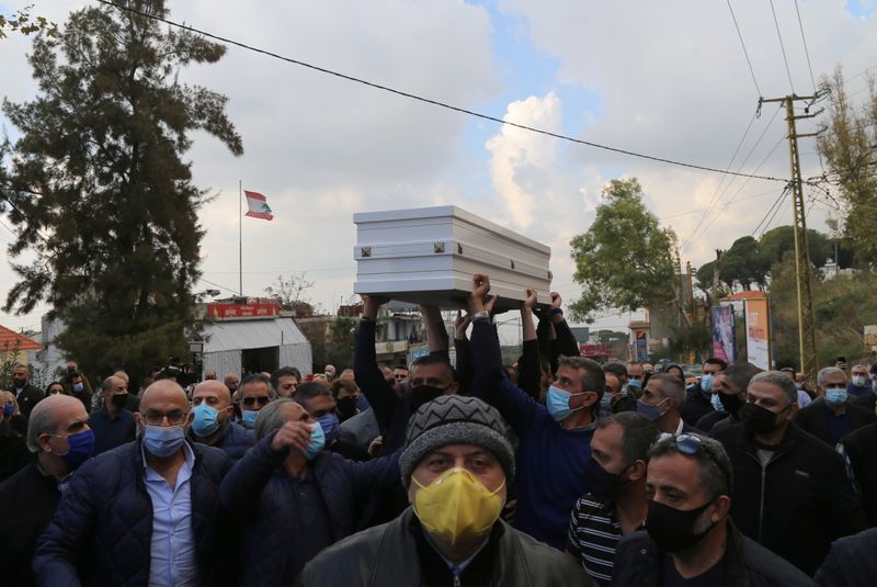 Men carry the coffin of Joe Bejjany, a 36-year-old telecoms