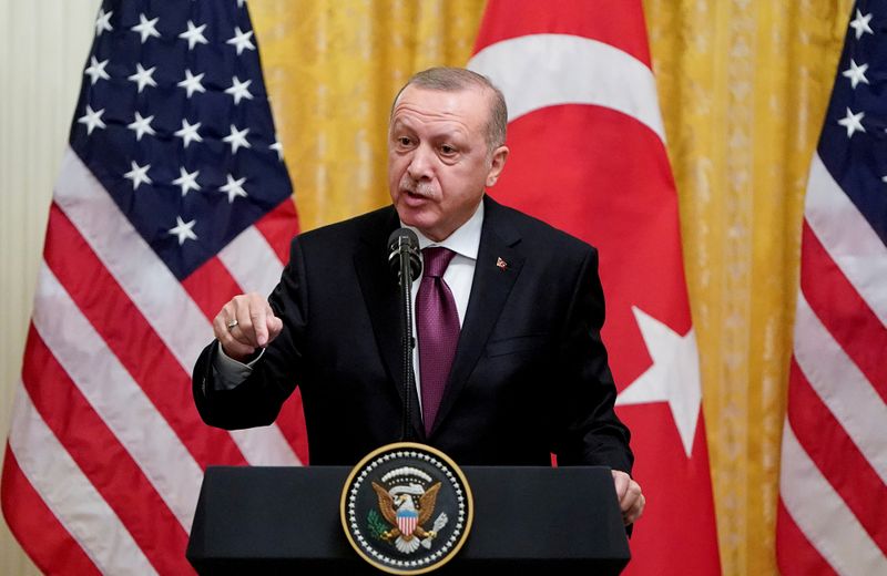 FILE PHOTO: Turkish President Tayyip Erdogan answers questions during a