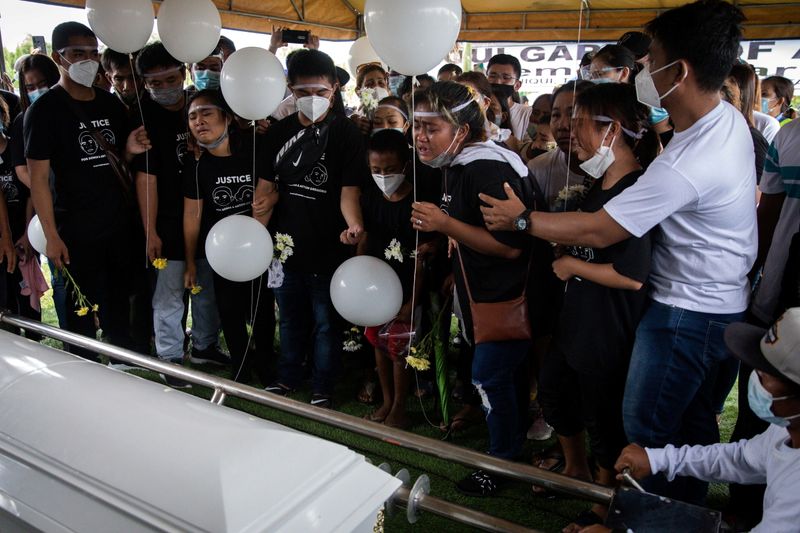 Family buries Filipino mother and son shot by police over