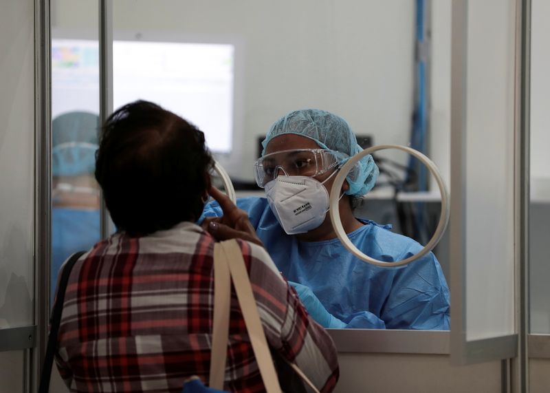 FILE PHOTO:  A woman gets tested for the coronavirus
