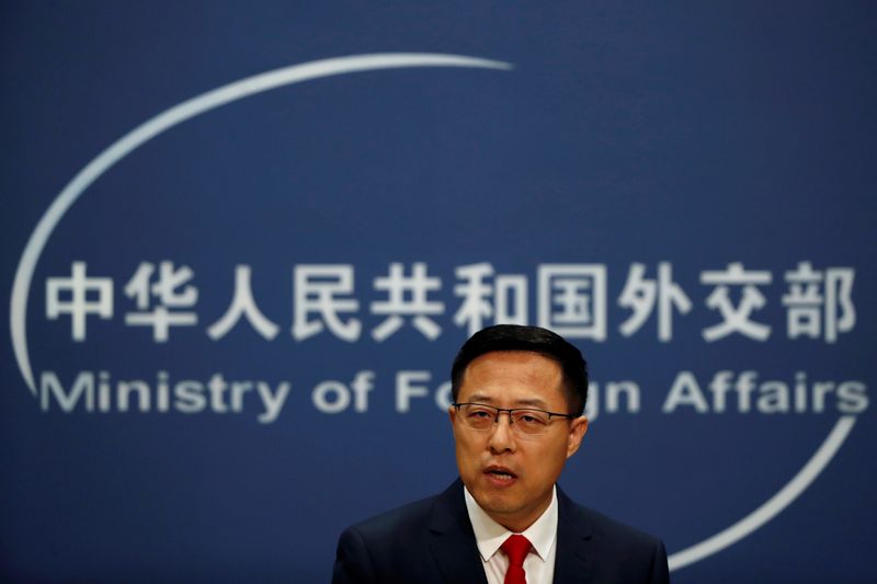 FILE PHOTO:  Chinese Foreign Ministry spokesman Zhao Lijian attends