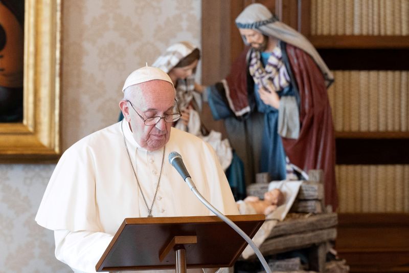 FILE PHOTO: Pope Francis leads Angelus prayer inside a library,