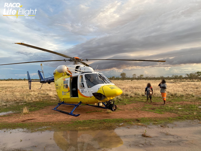 A RACQ Lifeflight Rescue helicopter conducts a rescue mission of