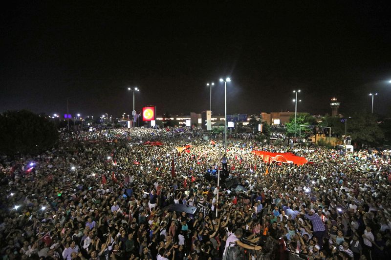 FILE PHOTO: People demonstrate outside Ataturk international airport during an