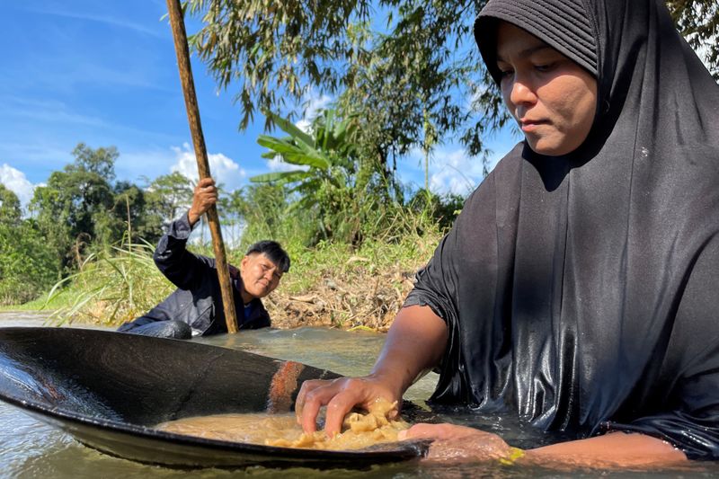 Thai women panning for gold in COVID-hit economy