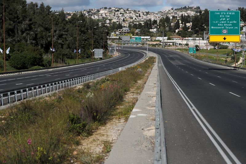 A main road in Jerusalem is seen deserted in the