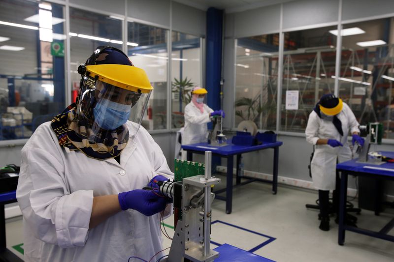 Employees work on a Moroccan ventilator at a factory in