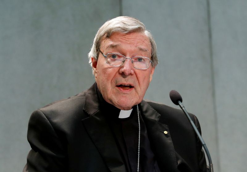 FILE PHOTO: Cardinal George Pell attends a news conference at
