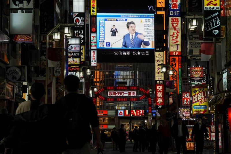 FILE PHOTO: A large screen on a building shows Japan’s
