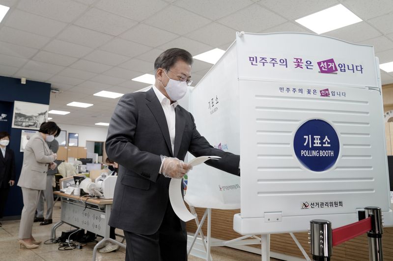South Korean President Moon Jae-in casts his absentee ballot at