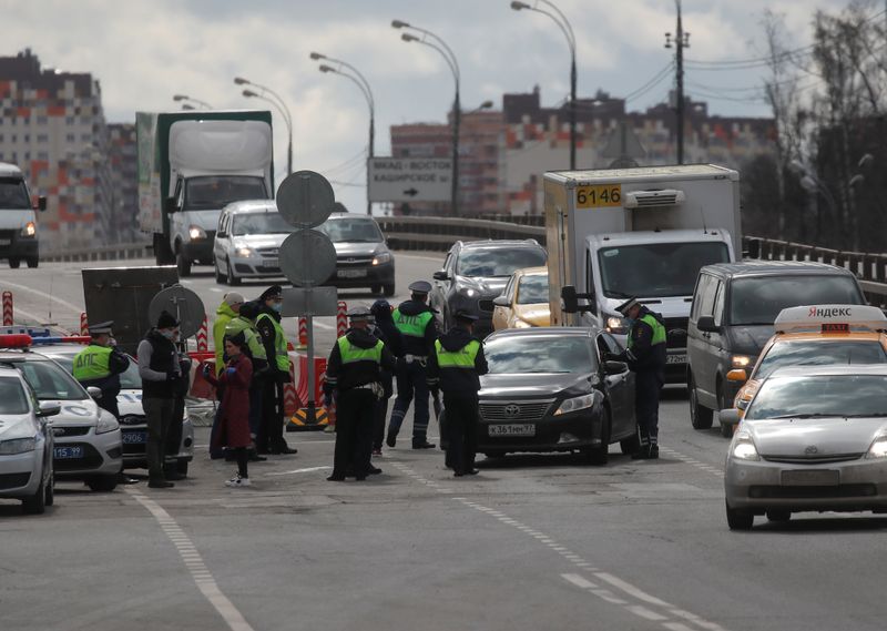 Traffic police officers work at a check point on the