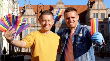 Gay couple Dawid Mycek and Jakub Kwiecinski pose with the