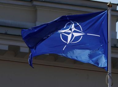 NATO flag flutters during the celebration of the 15th anniversary
