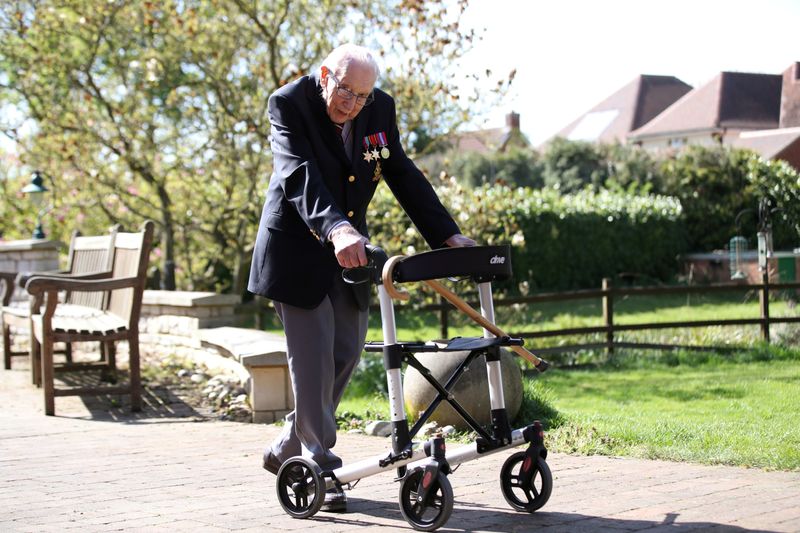 FILE PHOTO: Retired British Army Captain Moore walks to raise