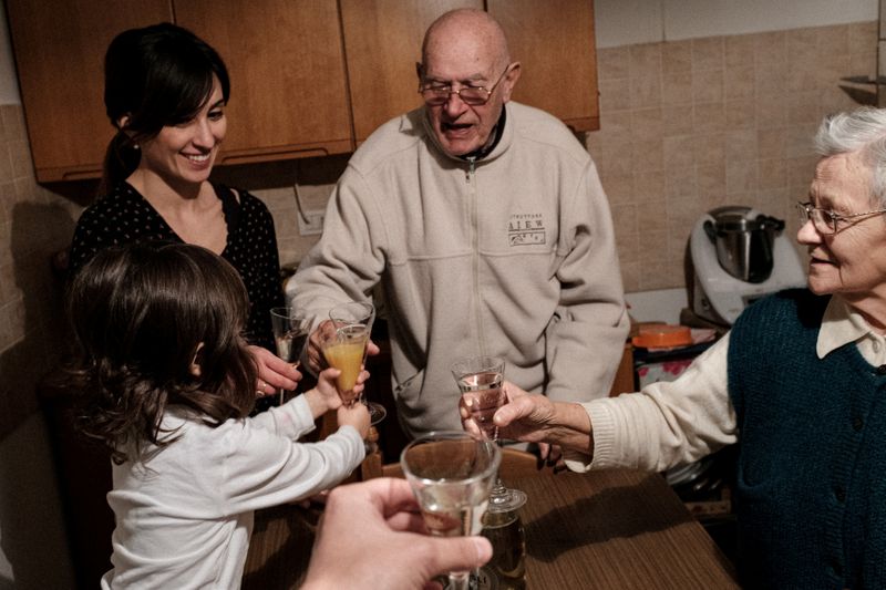 The Wider Image: In Italy, four generations in a coronavirus