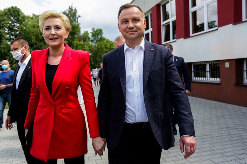 Polish President Duda visits a polling station during the second