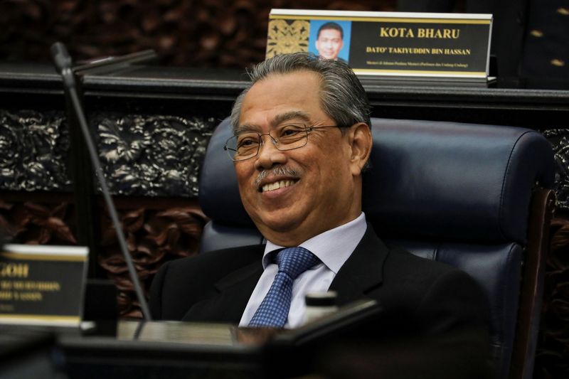 Malaysia’s Prime Minister Muhyiddin Yassin smiles during a session of