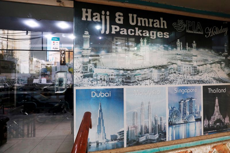 A sign promotes airline’s Haj and Umrah packages outside a