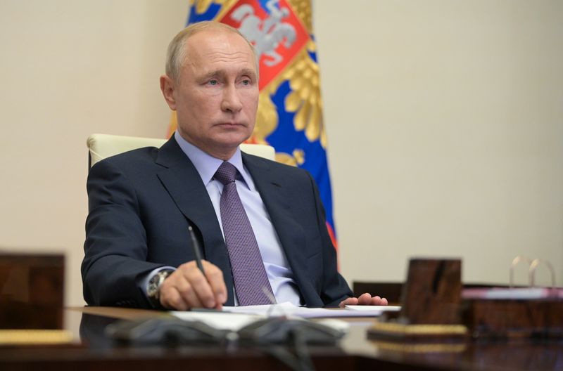 Russia’s President Vladimir Putin takes part in a video conference