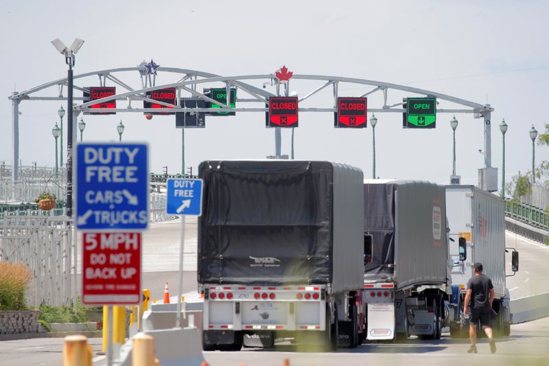 FILE PHOTO: Trucks prepare to cross The Peace Bridge, which