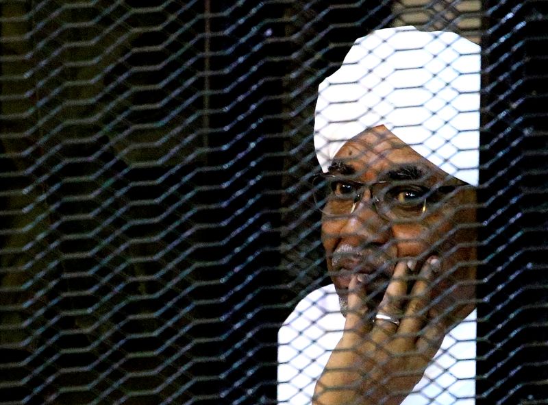 FILE PHOTO: Sudan’s former President Omar Hassan al-Bashir sits inside