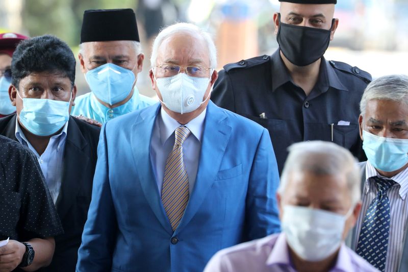 Former Malaysian Prime Minister Najib Razak and his supporters arrive