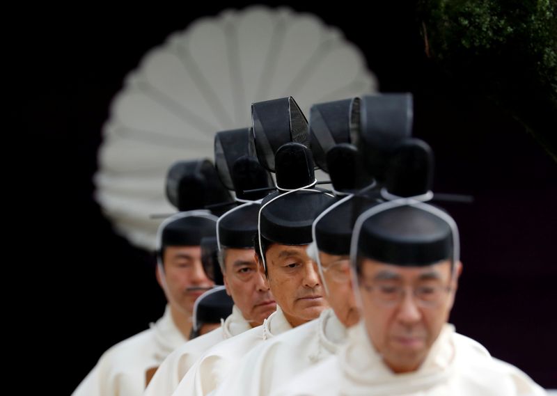 FILE PHOTO: Japanese Shinto priests attend a ritual during an