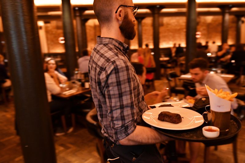 Staff work at Hawksmoor, on the opening day of “Eat