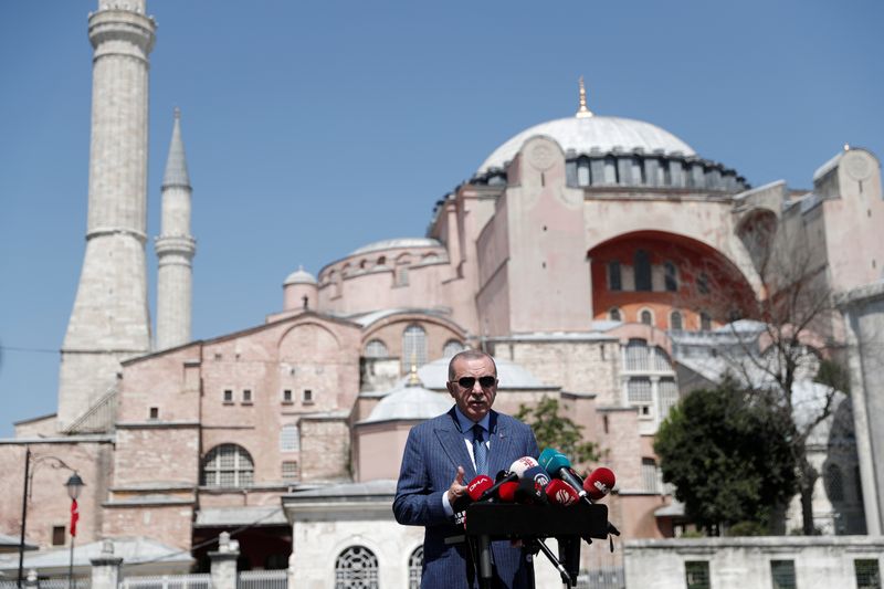 Turkish President Tayyip Erdogan talks to media after attending Friday