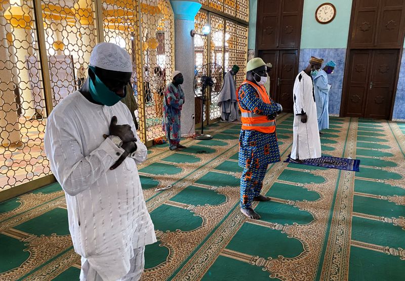Muslim worshippers attend Friday prayers inside a mosque in Lagos