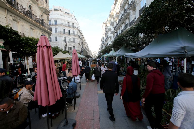 People walk in Algiers