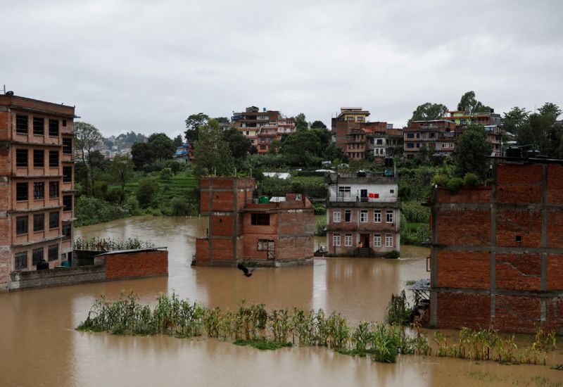 FILE PHOTO: Houses are seen submerged in the waters as