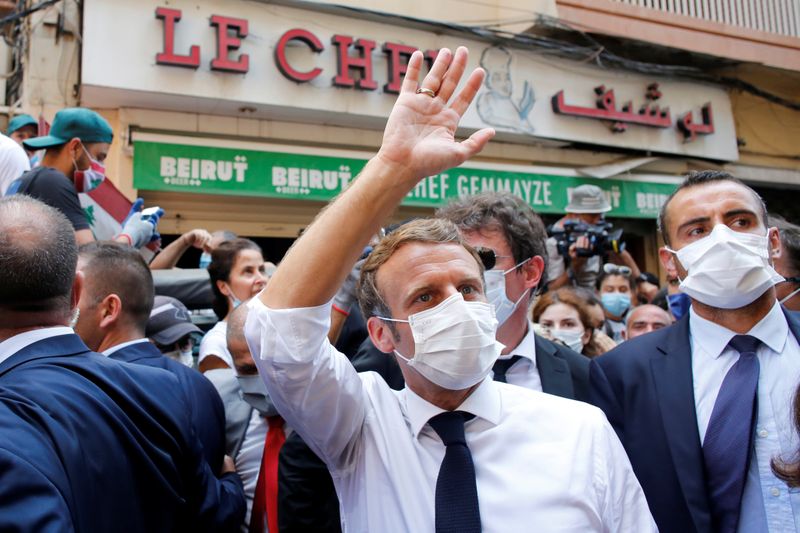 FILE PHOTO: French President Emmanuel Macron visits devastated streets of