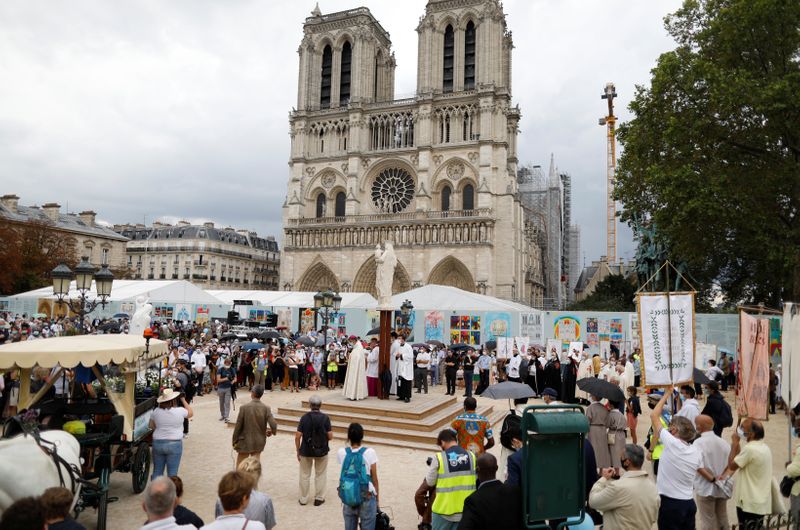 French Catholics gather at Notre Dame Cathedral square