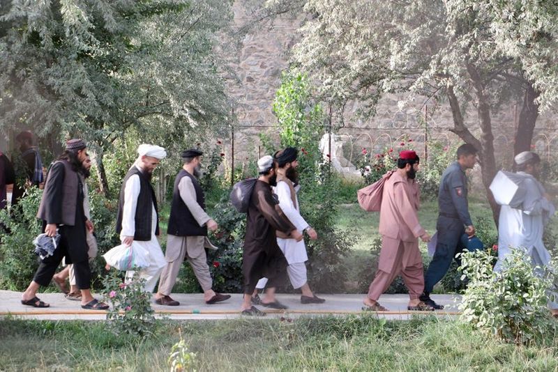 FILE PHOTO: Newly freed Taliban prisoners walk at Pul-e-Charkhi prison,