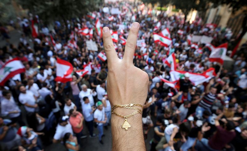FILE PHOTO: A demonstrator gestures during an anti-government protest in