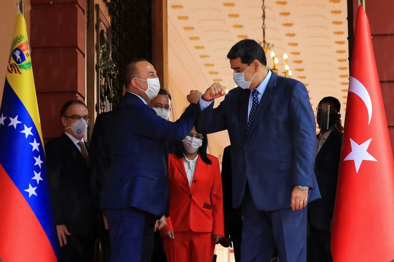 Venezuela’s President Nicolas Maduro and Turkish Foreign Minister Mevlut Cavusoglu,