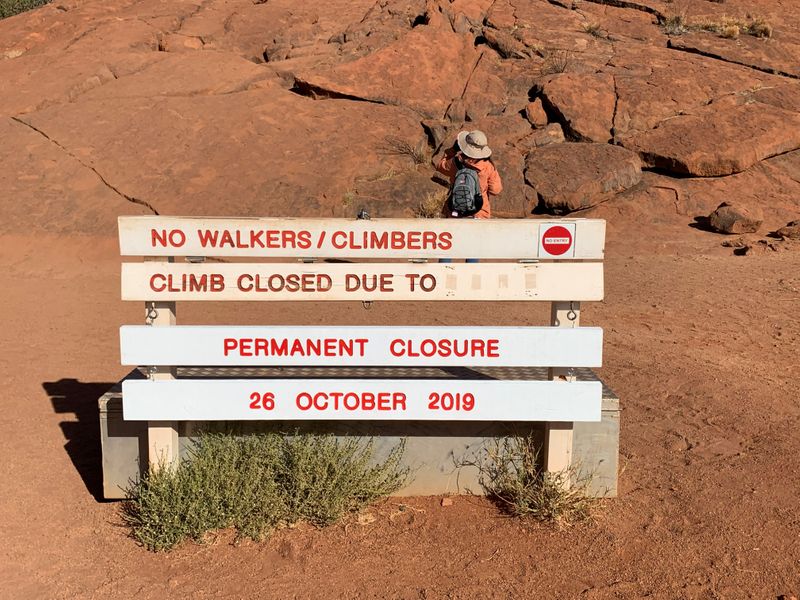 A new permanent closure sign is installed at Uluru, formerly