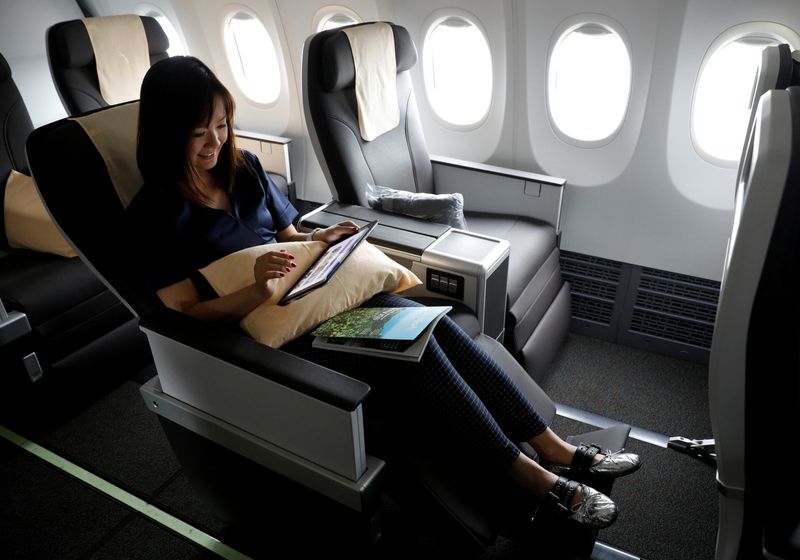 FILE PHOTO: A woman poses as she shows the recline