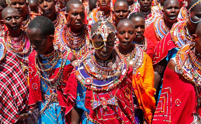 Maasai women sing for their men of Matapato clan before