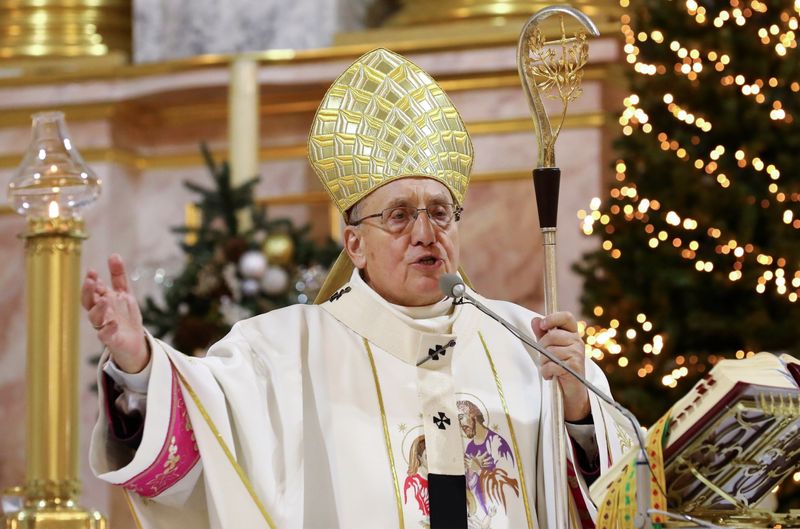 Archbishop Tadeusz Kondrusiewicz conducts a service on Christmas Eve in
