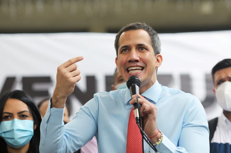 Opposition leader Juan Guaido speaks to the media during a