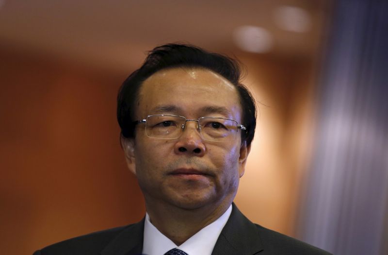 China Huarong Asset Management Co Chairman Lai Xiaomin listens to