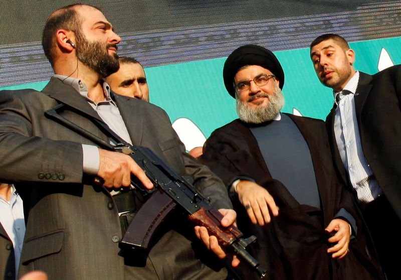 FILE PHOTO: Lebanon’s Hezbollah leader Sayyed Hassan Nasrallah greets his