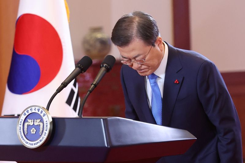 South Korean President Moon Jae-in bows before delivering the New
