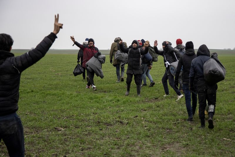FILE PHOTO: Migrants on Serbia, Hungary, Romania border prepare to