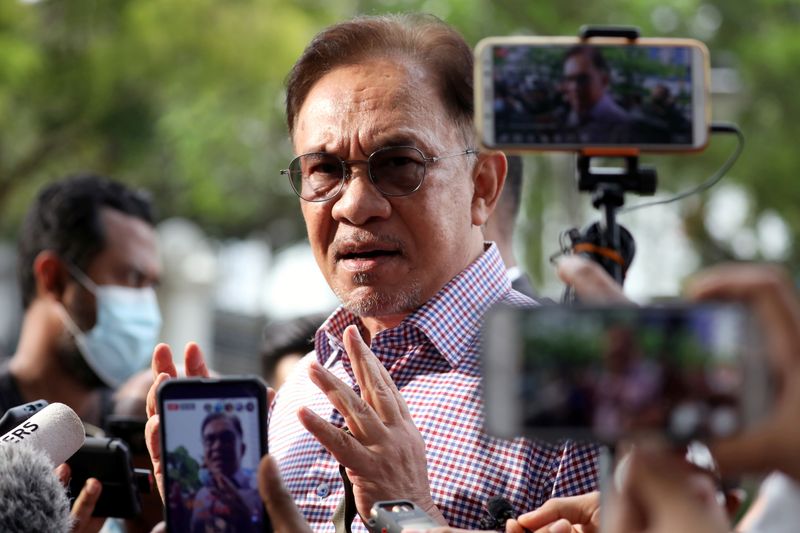 FILE PHOTO: Malaysia opposition leader Anwar Ibrahim speaks to media